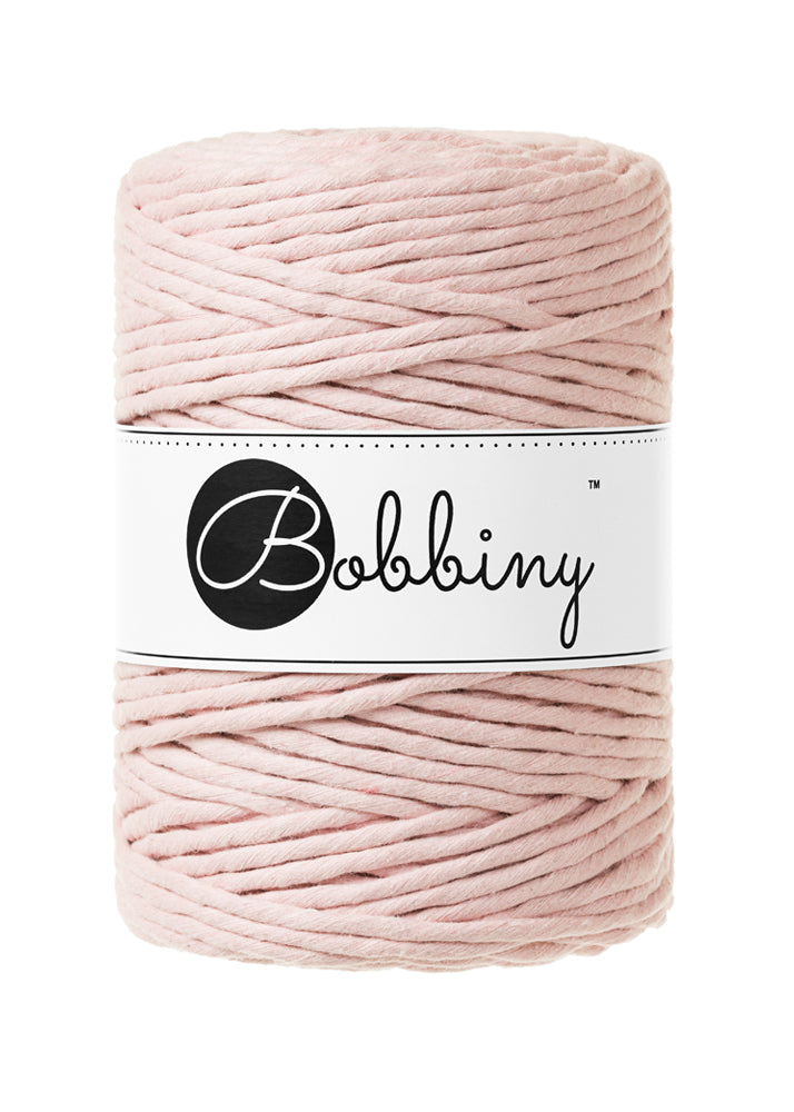 This super soft cord is perfect for Macrame or any other fibre art, and makes the most spectacular fringes and tassels.  Shown here in the gorgeous new shade of 'Pastel Pink'  It is made from 100% recycled cotton, is single twist and contains 112 individual fibres.  They are non-toxic, certified safe for children and meet certified worldwide textile standards.  The inner spool is made from recycled paper and is biodegradable.