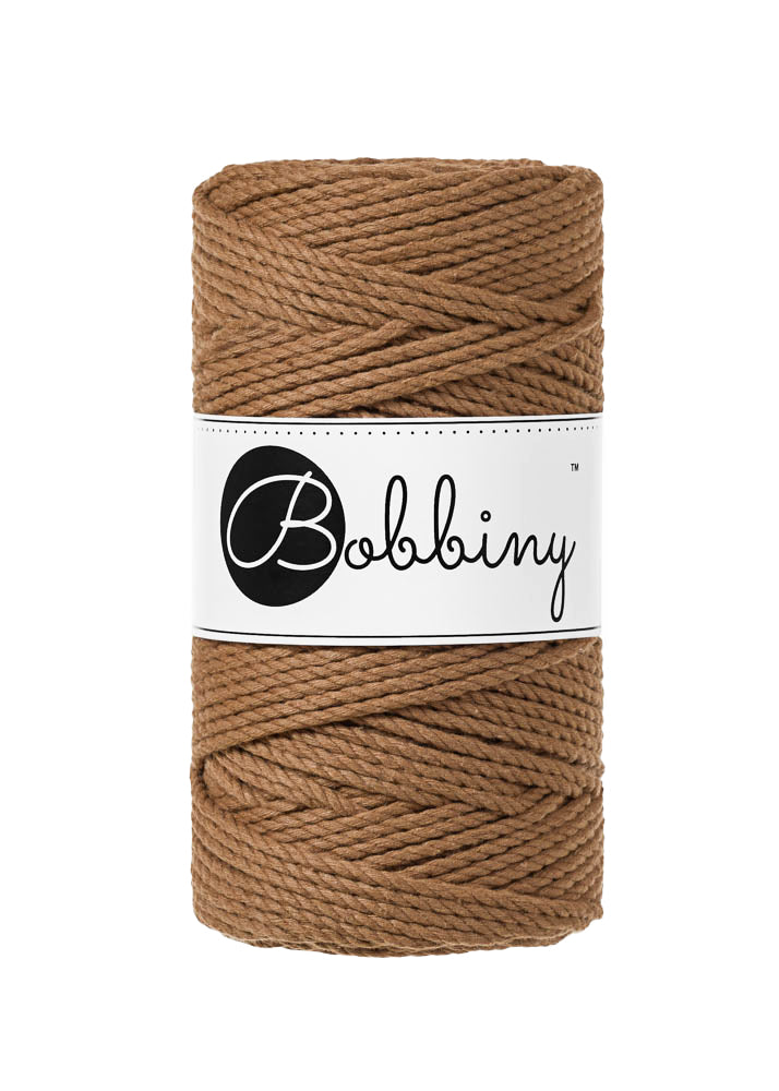 This superb product from Bobbiny is the latest addition to their gorgeous range of products.  Made from 100% recycled cotton, it is perfect for Macrame projects due to its sturdiness. It contains no harmful dyes or chemicals and is OEKO-TEK certified.  This super soft triple twist rope also makes the most spectacular fringes and tassels.  Length: 100m (108 Yards)  Weight: 400gms  Contains 60 Fibres ( 3x20 )  Also available in 5mm