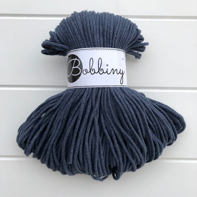 Where can I find Bobbiny Braided Cords Bobbiny Junior 3mm - 100m Jeans? These beautiful Bobbiny ropes are made in Poland, and are non-toxic and certified safe for children, meeting certified worldwide textile standards.  3mm Diameter  100 metres Length  Recommended for use with 8-10mm crochet or knitting needles  Cotton inner and outer layers, perfect for use with Macrame, Crochet or Knitting.