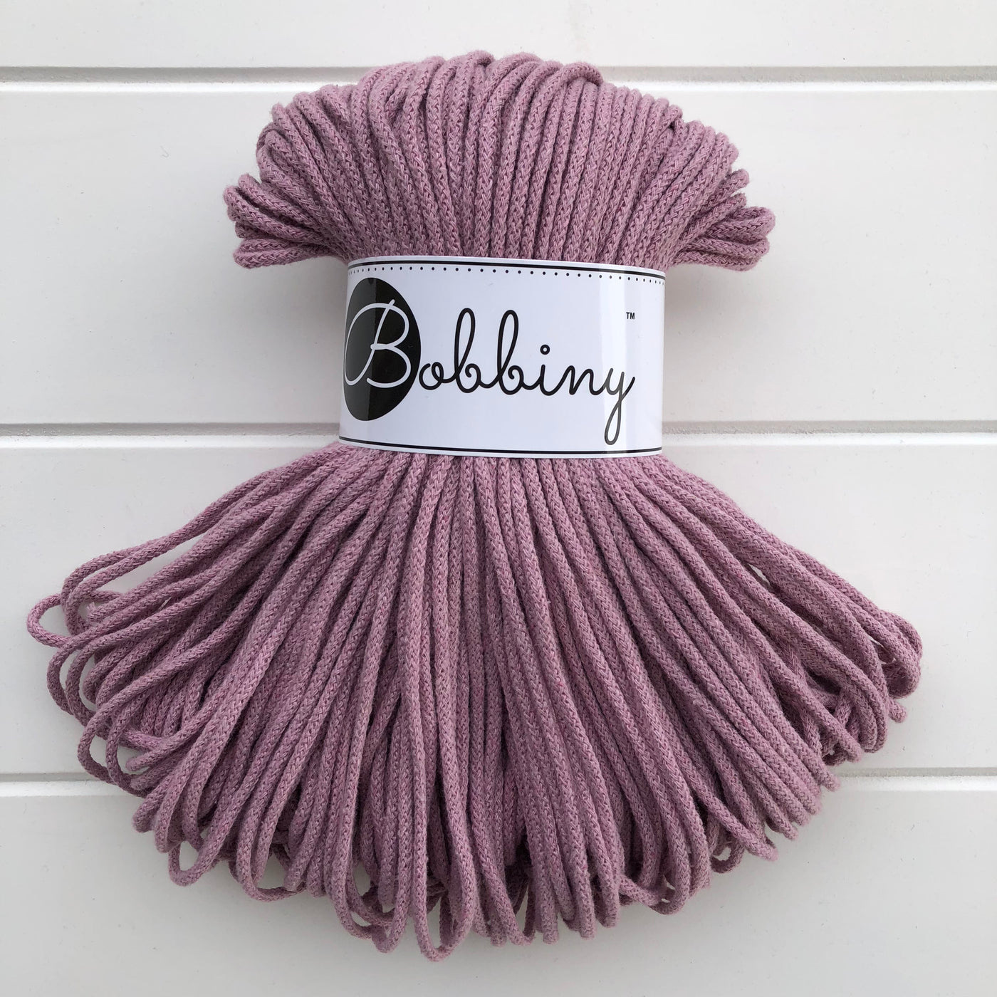 Where can I find Bobbiny Braided Cords Bobbiny Junior 3mm - 100m Dusky Pink? These beautiful Bobbiny ropes are made in Poland, and are non-toxic and certified safe for children, meeting certified worldwide textile standards.  3mm Diameter  100 metres Length  Recommended for use with 8-10mm crochet or knitting needles  Cotton inner and outer layers, perfect for use with Macrame, Crochet or Knitting   