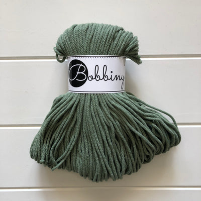 Where can I find Bobbiny Braided Cords Bobbiny Junior 3mm - 100m Eucalyptus? These beautiful Bobbiny ropes are made in Poland, and are non-toxic and certified safe for children, meeting certified worldwide textile standards.  3mm Diameter  100 metres Length  Recommended for use with 8-10mm crochet or knitting needles  Cotton inner and outer layers, perfect for use with Macrame, Crochet or Knitting