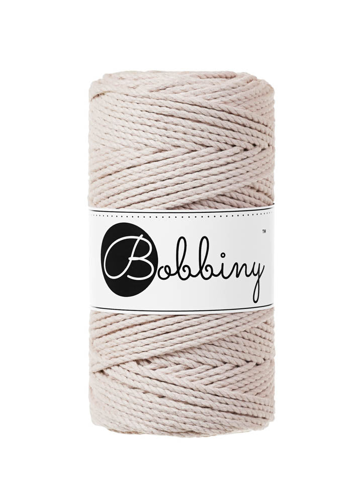 This superb product from Bobbiny is the latest addition to their gorgeous range of products.  Made from 100% recycled cotton, it is perfect for Macrame projects due to its sturdiness. It contains no harmful dyes or chemicals and is OEKO-TEK certified.  This super soft triple twist rope also makes the most spectacular fringes and tassels.  Length: 100m (108 Yards)  Weight: 400gms  Contains 60 Fibres ( 3x20 )  Also available in 5mm