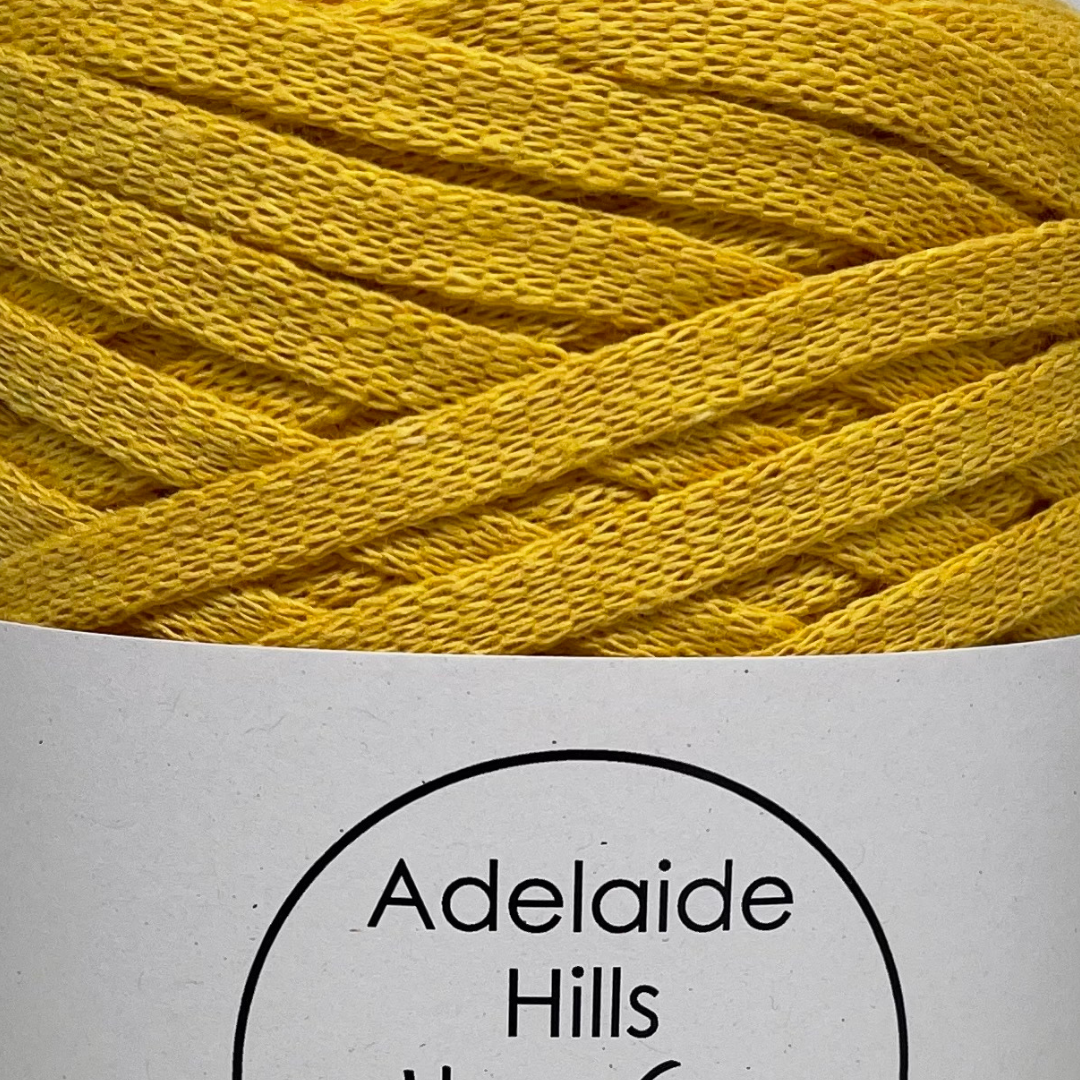 Where can I find Ribbon Yarn Turmeric? Our Ribbon Yarn is a beautifully soft woven tape-like fibre perfect for use with crochet, knitting, weaving or any fibre art. Made from 100% recycled fibres.   Length: 130metres +/-  Weight: 250gms +/-  For use with approx 7mm or above hooks depending on your project   